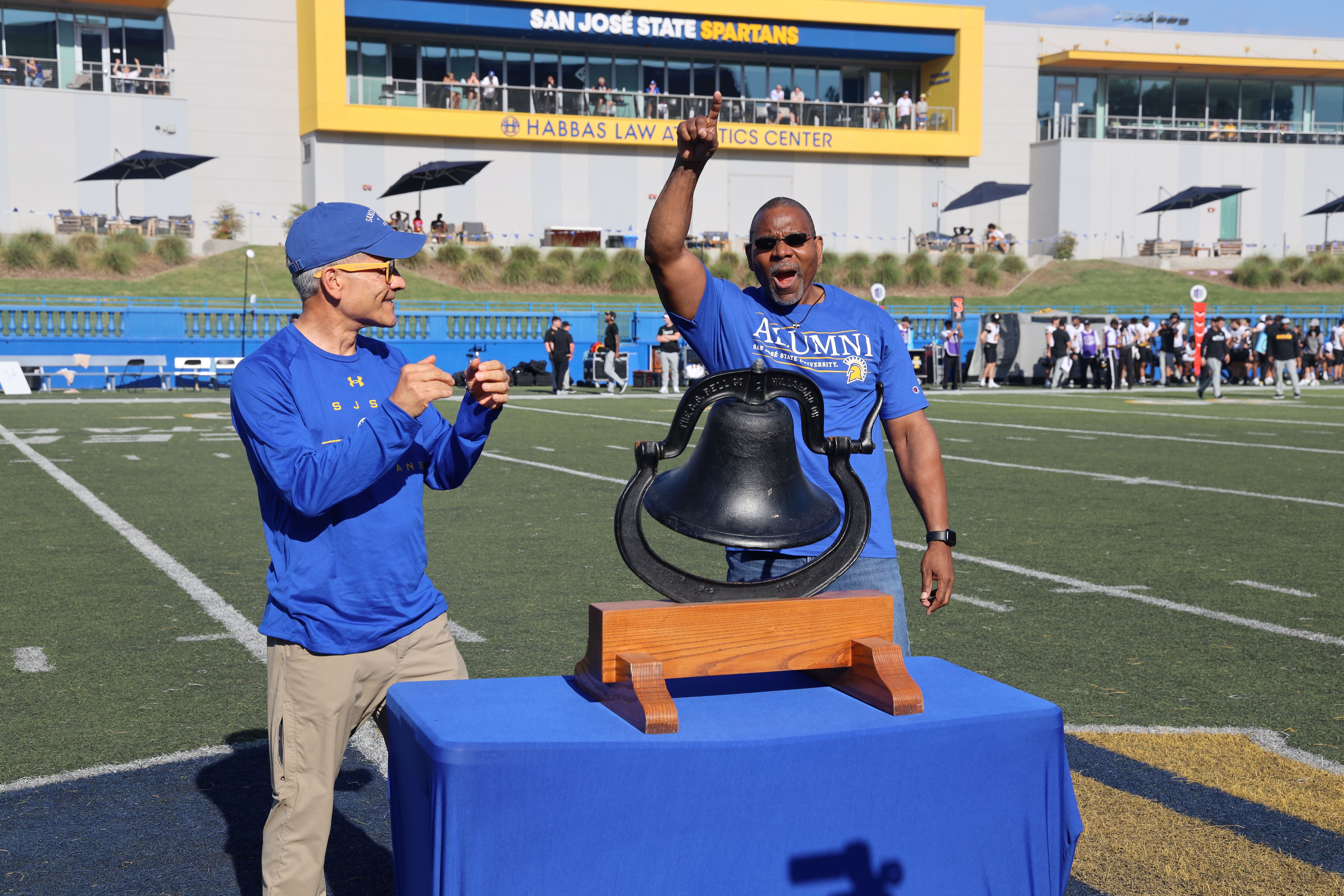 David Brown ringing the victory bell at the SJSU football game