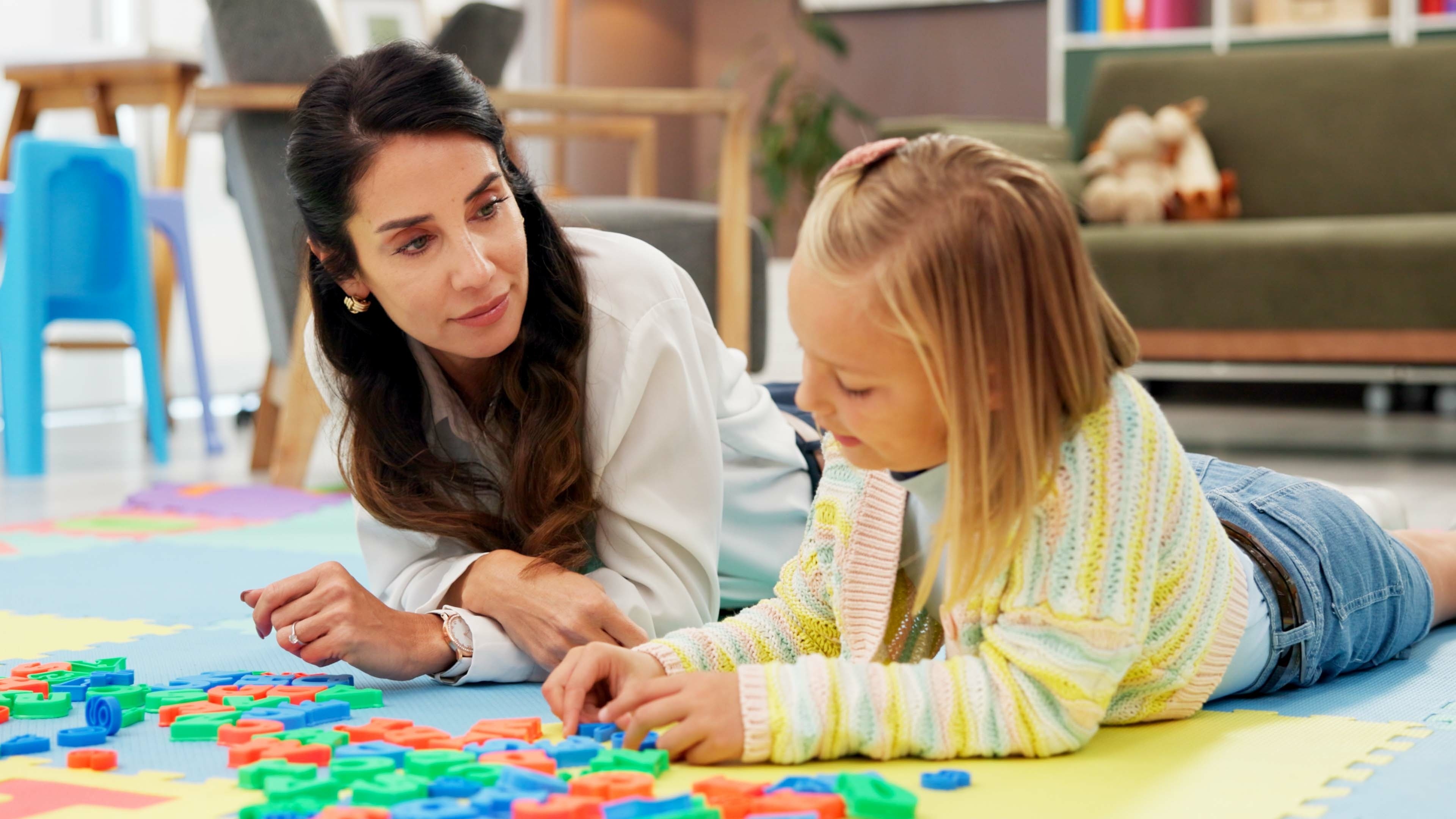 Psychologist observing a child completing a task