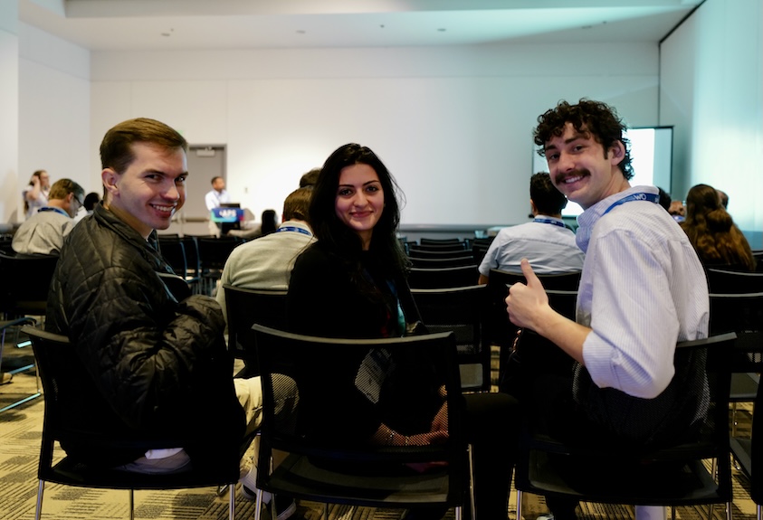Photograph of SJSU MS in Physics students in the audience at a conference.